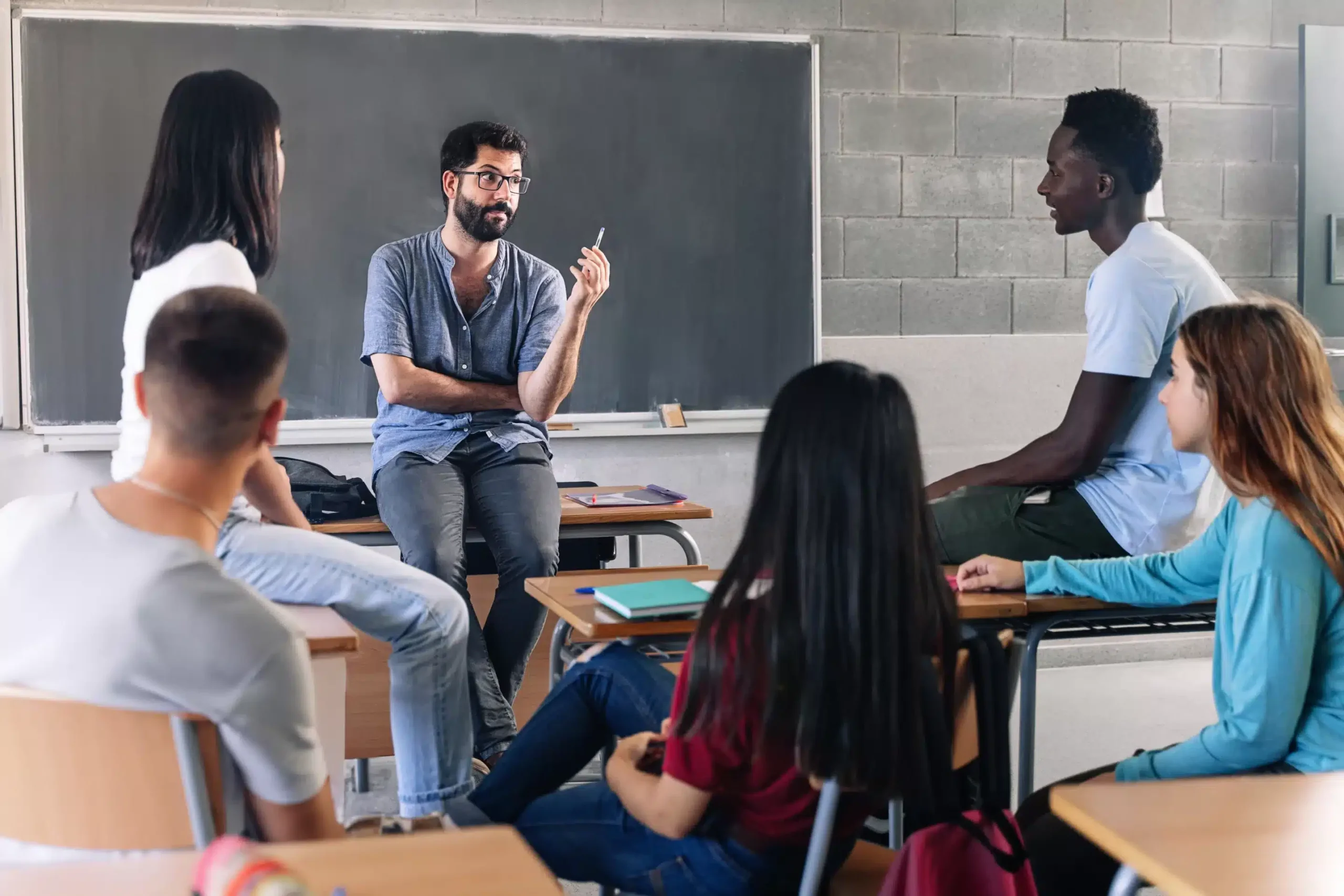 a man sitting in a classroom