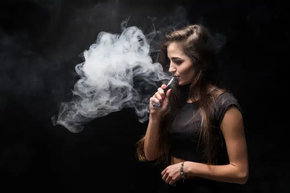 a woman smoking a vape. cannot stop vaping